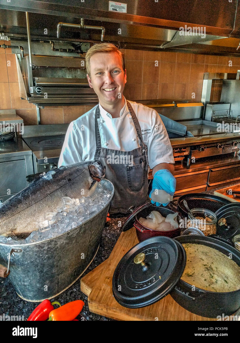 Executive Chef Colin Burslem cooks breaded halibut cheeks at GlobeYVR restaurant in the
