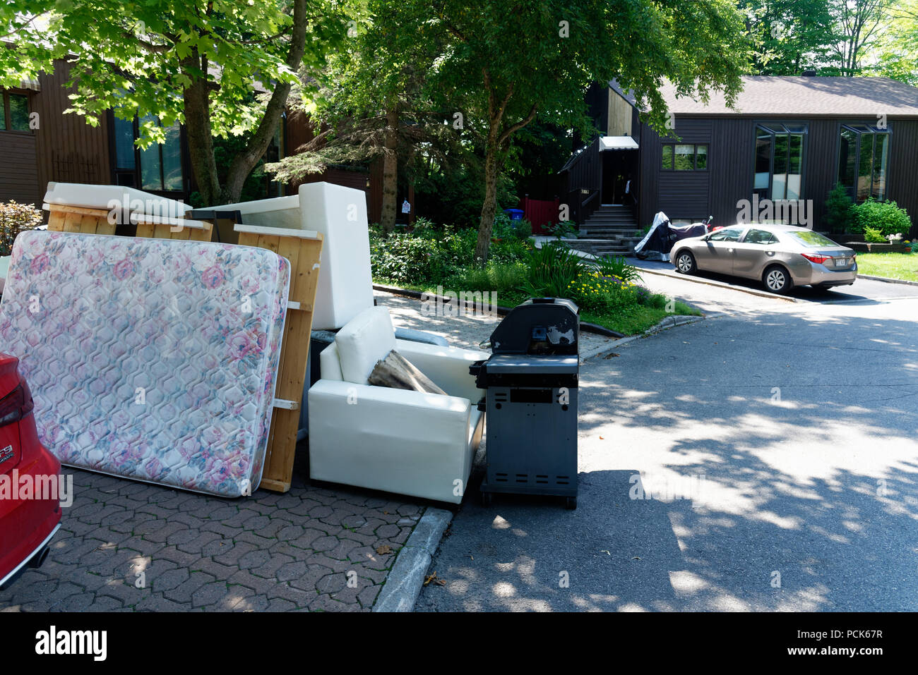 A huge pile of rubbish dumped in the street on Quebec's moving day July 1st. Stock Photo