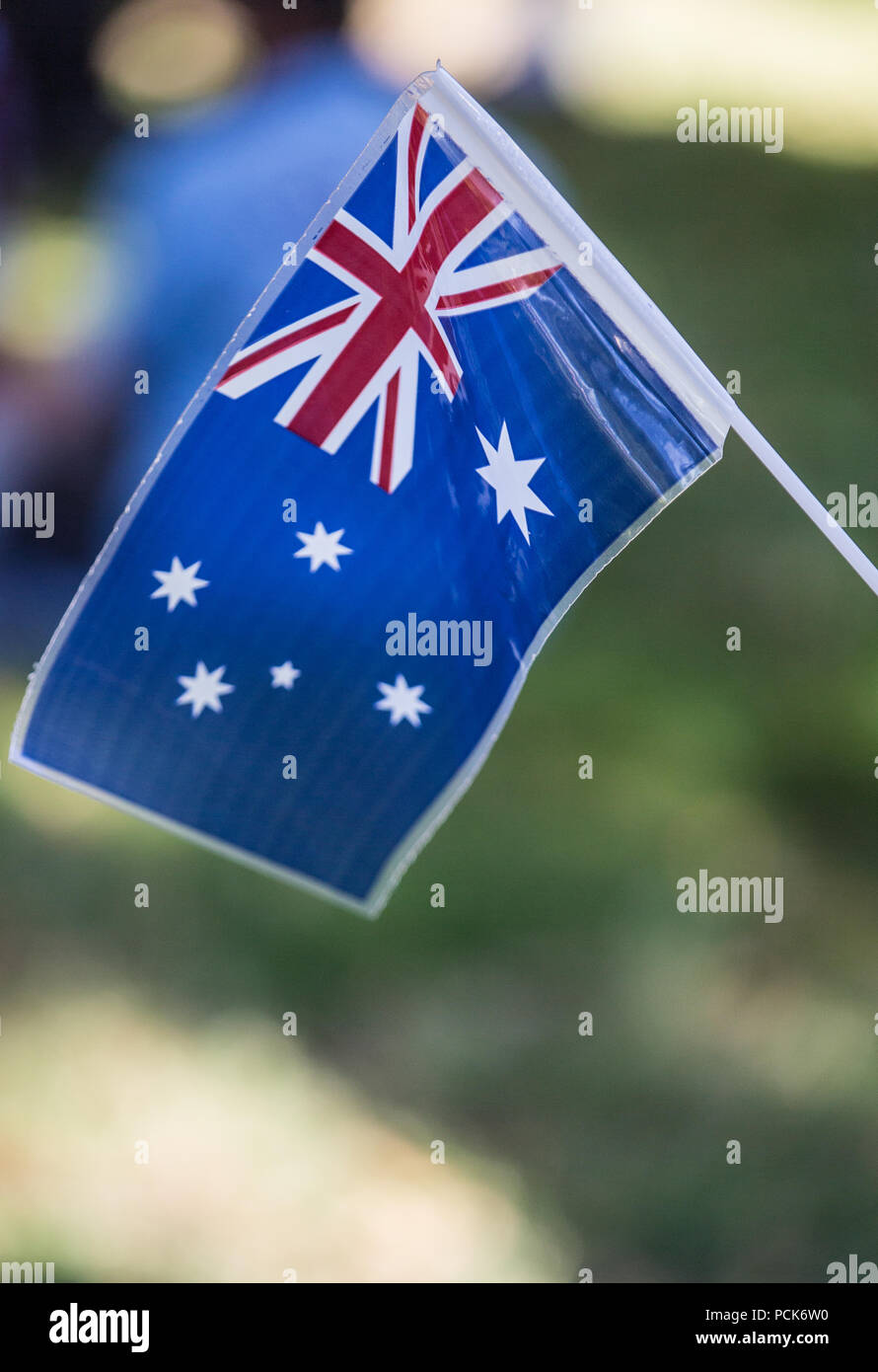 Australian flags being waved by school children Stock Photo