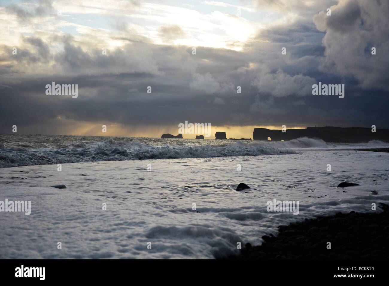 Sea Stacks, cliffs and caves at Black Sand Beach, Reynisfjara ...