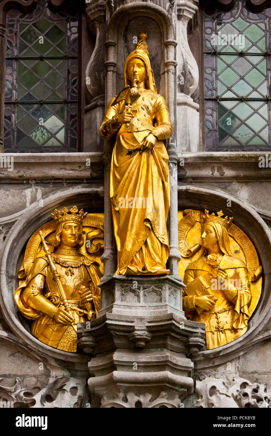 A golden statue in the facade of the Basilica of the Holy Blood in Bruges, Belgium. Stock Photo