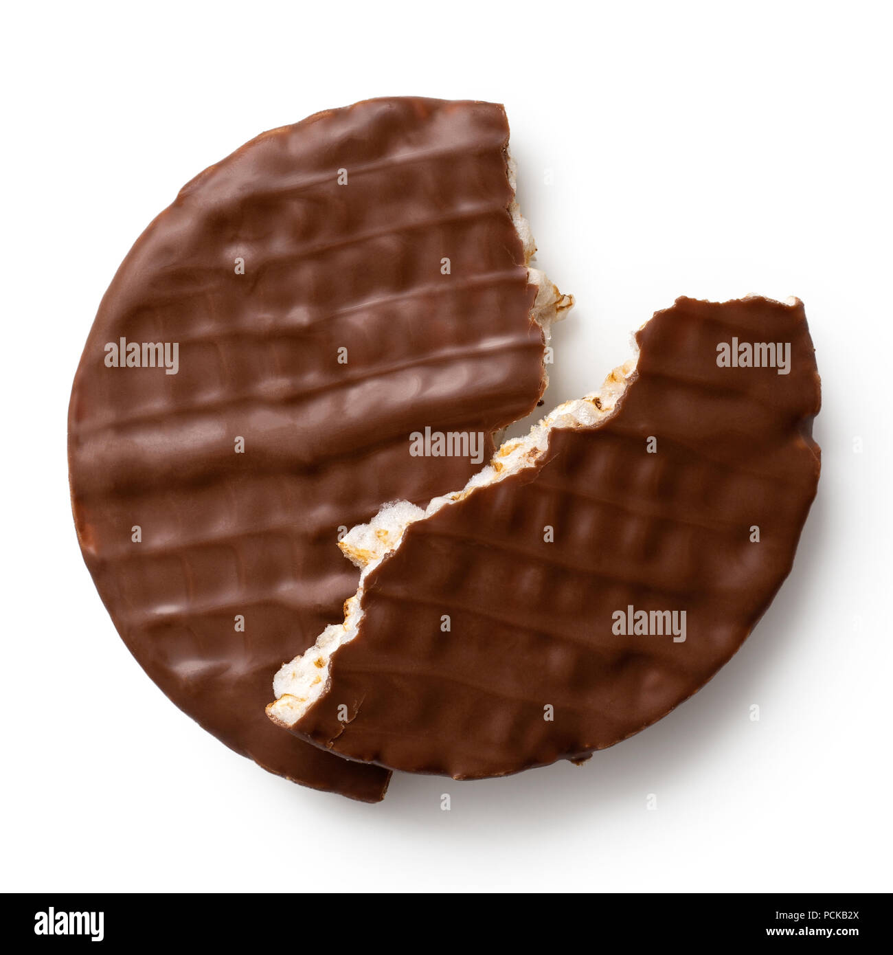 Broken chocolate rice cake isolated on white from above. Two pieces. Stock Photo