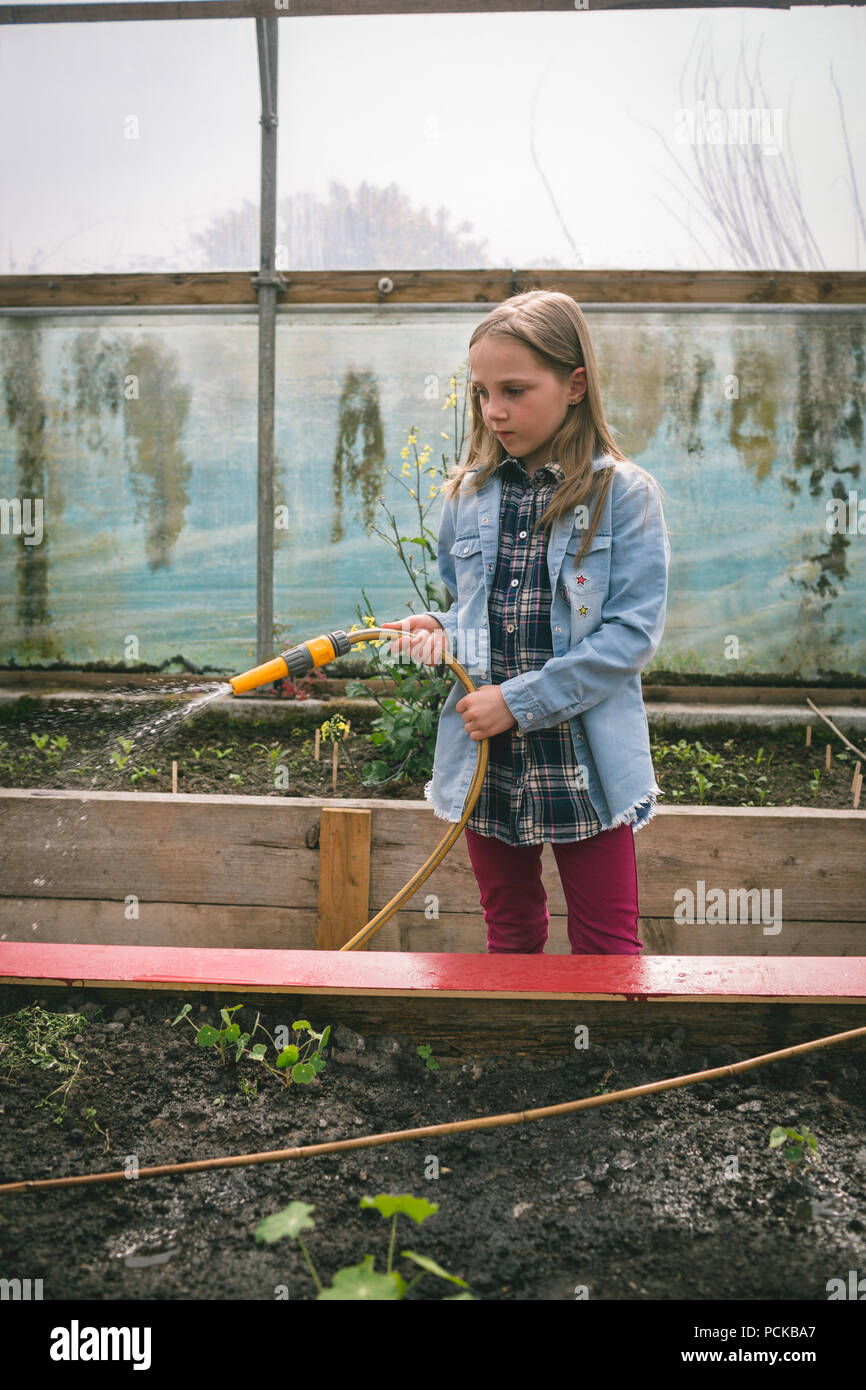 Girl in greenhouse hi-res stock photography and images - Alamy
