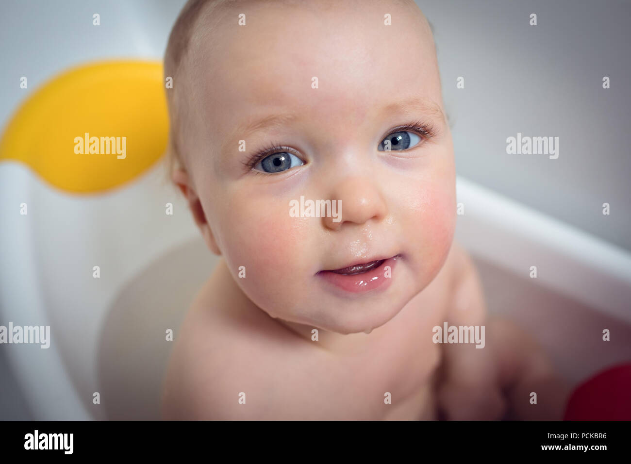 Baby girl taking bath in bathtub Stock Photo Alamy