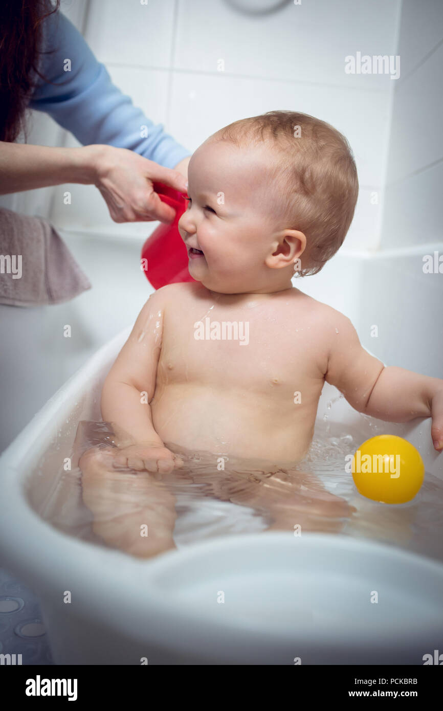 giving bath to baby