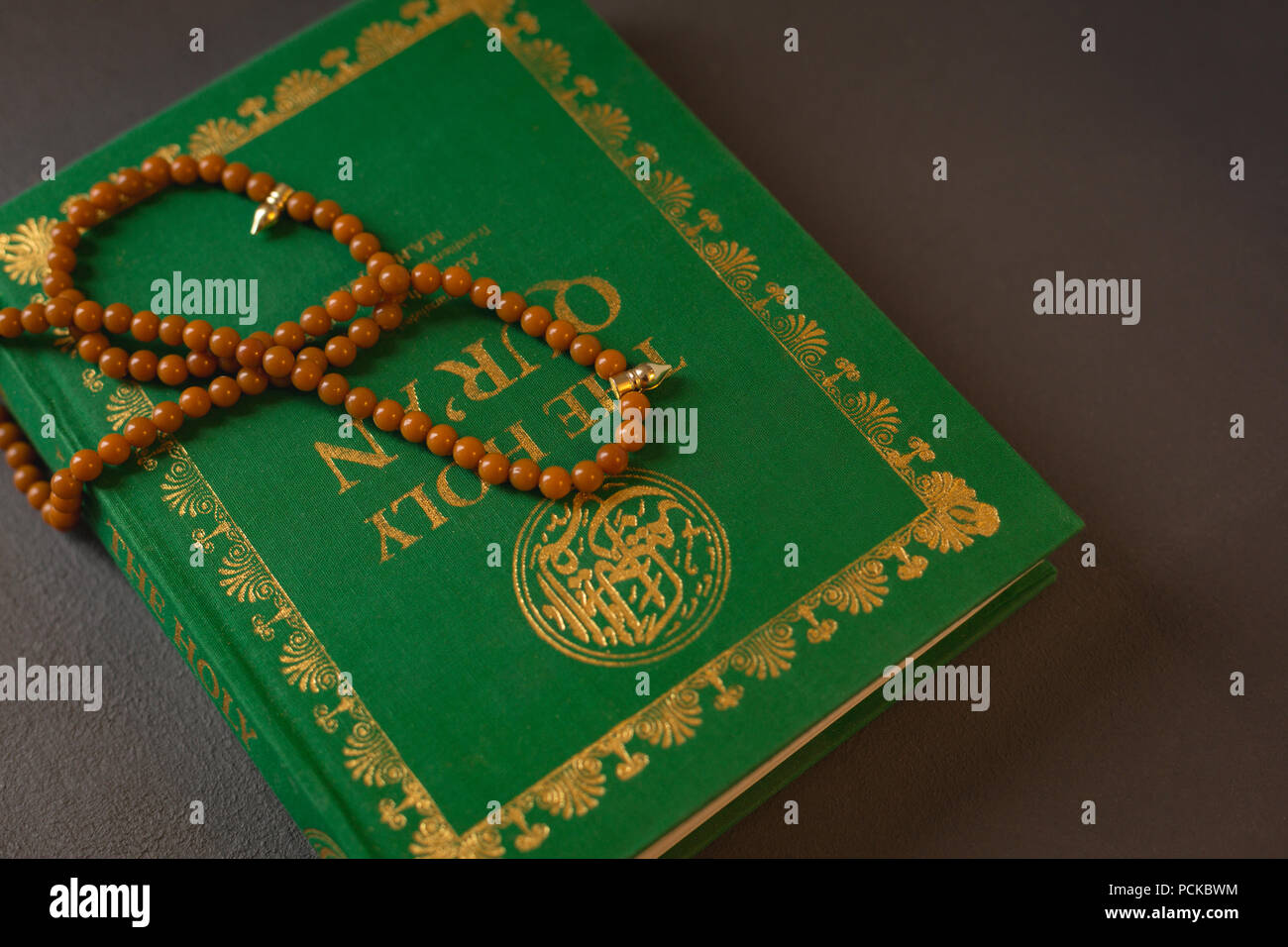 Prayer beads kept on holy Quran Stock Photo Alamy