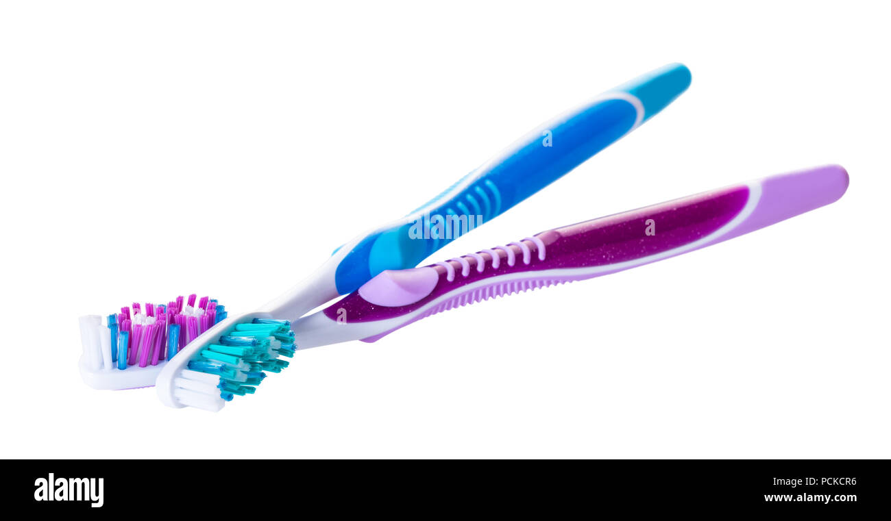 new toothbrushes close-up on white isolated background Stock Photo