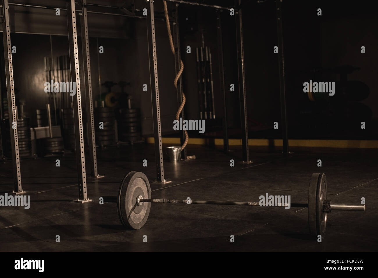 Barbell on a gym floor Stock Photo Alamy