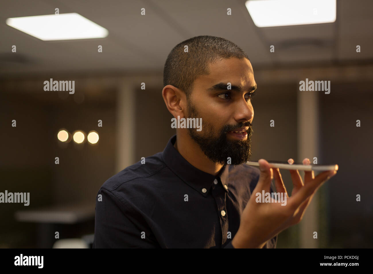 Male executive talking on mobile phone Stock Photo