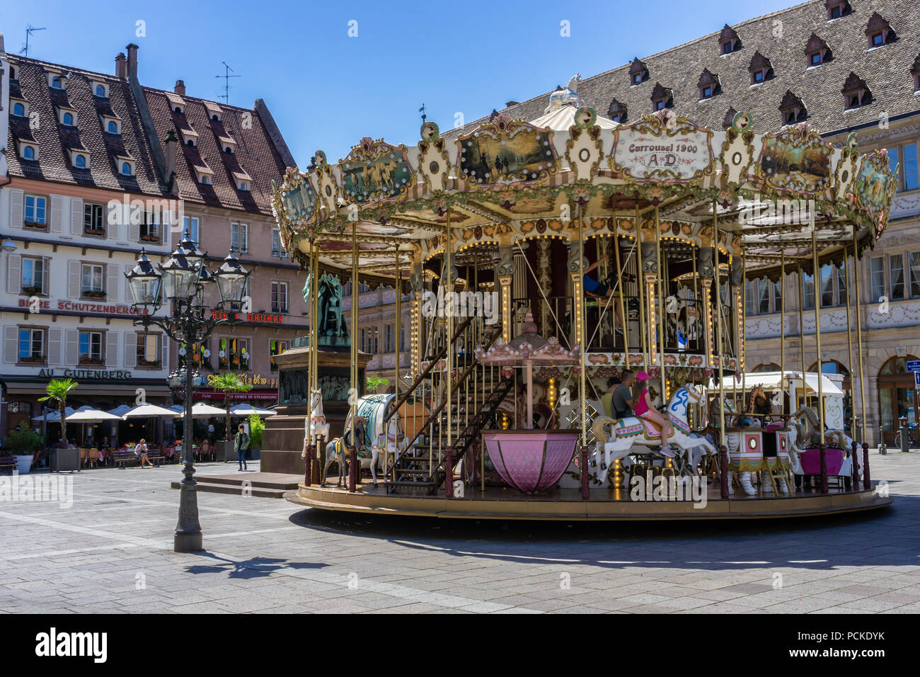 Johannes Gutenberg square with the old carousel in a beautiful day of summer in Strasbourg, France. Stock Photo