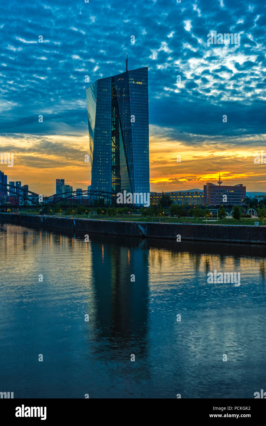 European Central Bank, ECB, at sunset in front of skyline, cloud sky (Altocumulus), Osthafenbrücke, Frankfurt am Main, Hesse Stock Photo
