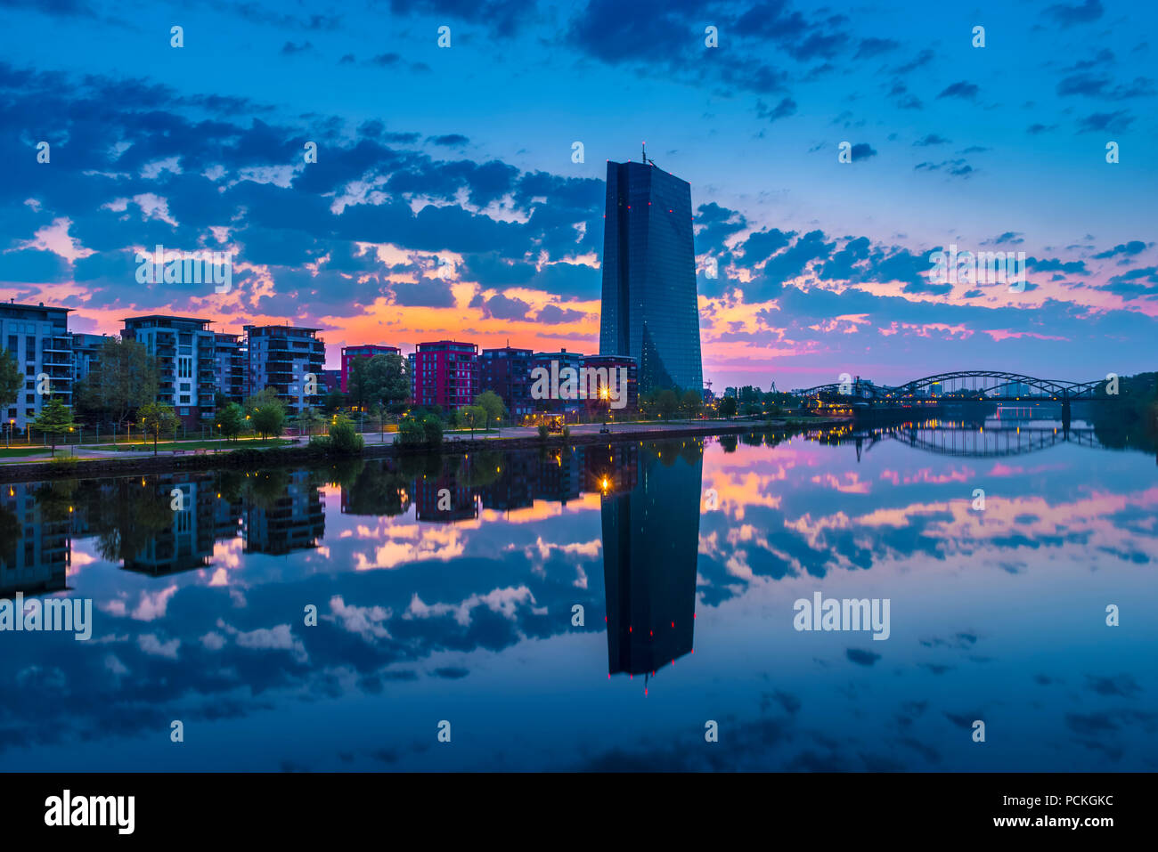 View across the river Main to the European Central Bank, ECB, in front of sunrise, cloud sky (Altocumulus), Frankfurt am Main Stock Photo