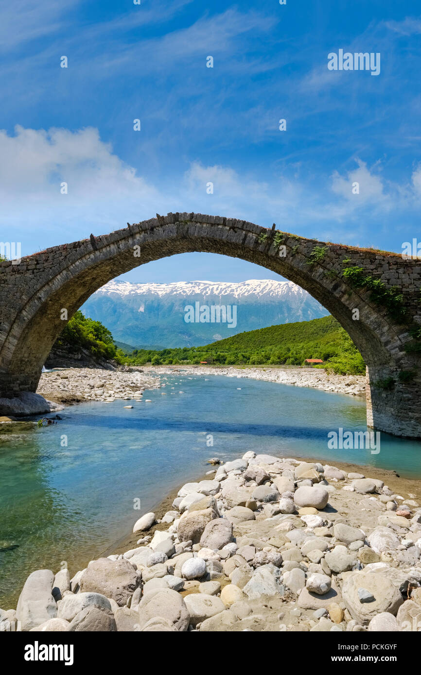 Ottoman stone arch bridge Ura e Kadiut, River Lengarica, Lengaricë, near Permet, National Park Hotova-Dangell, Qar Gjirokastra Stock Photo