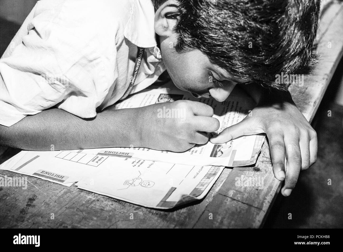 PONDICHERY, PUDUCHERRY, TAMIL NADU, INDIA - SEPTEMBER CIRCA, 2017. Close up portrait unidentified young, little boy child without glasses, writing on  Stock Photo