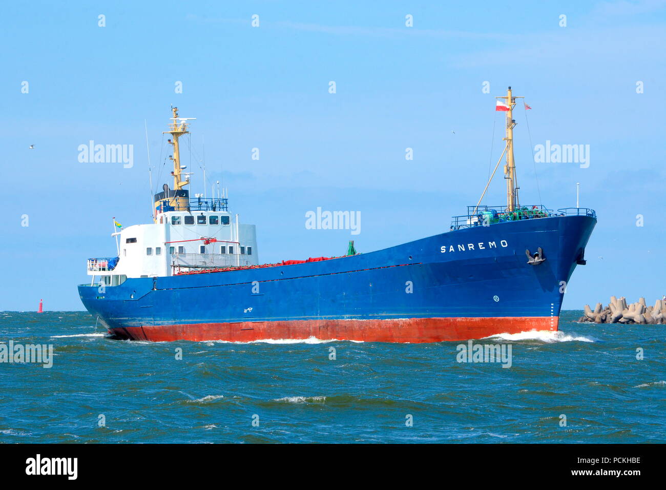 Cargo ship coming in to the harbor in Swinoujscie, Western Pomerania, Poland Stock Photo