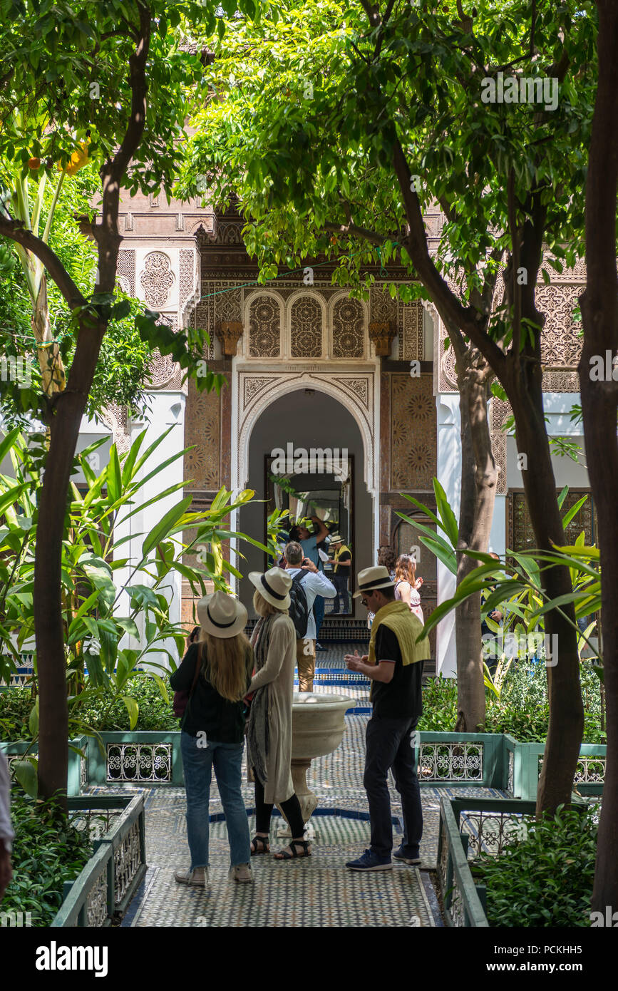 Tourists in a courtyard, garden of the Bahia Palace, Marrakech, Kingdom of Morocco Stock Photo