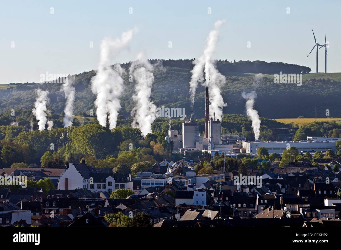 Vertical rising columns of smoke in calm, Mayen, Eifel, Rhineland-Palatinate, Germany Stock Photo