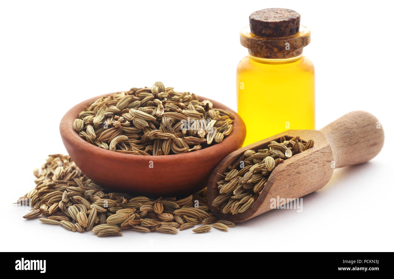 Fennel seeds with essential oil in a bottle over white background Stock  Photo - Alamy