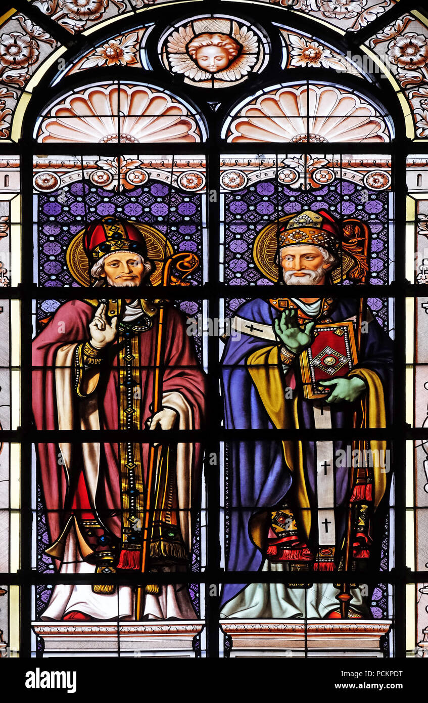 Saint Martin and Saint Ambrose, stained glass window in the Saint Augustine church in Paris, France Stock Photo