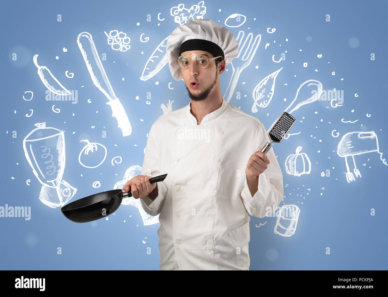 Young cook with kitchen instruments and drawn recipe concept on ...