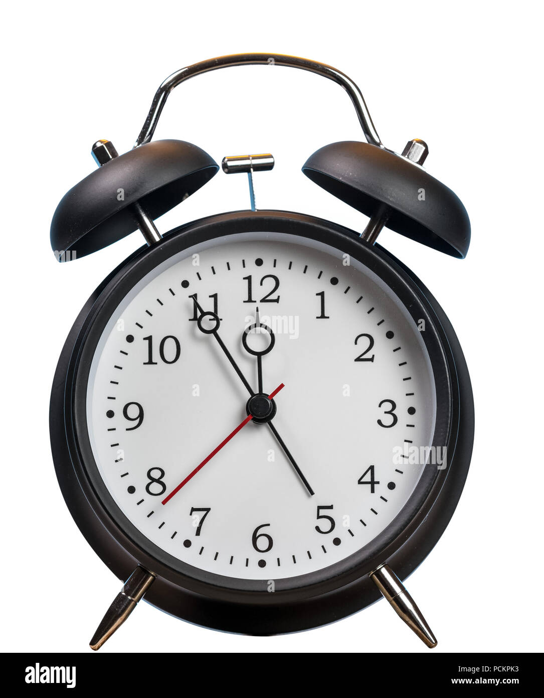 Alarm clock approaching midnight and isolated against white Stock Photo