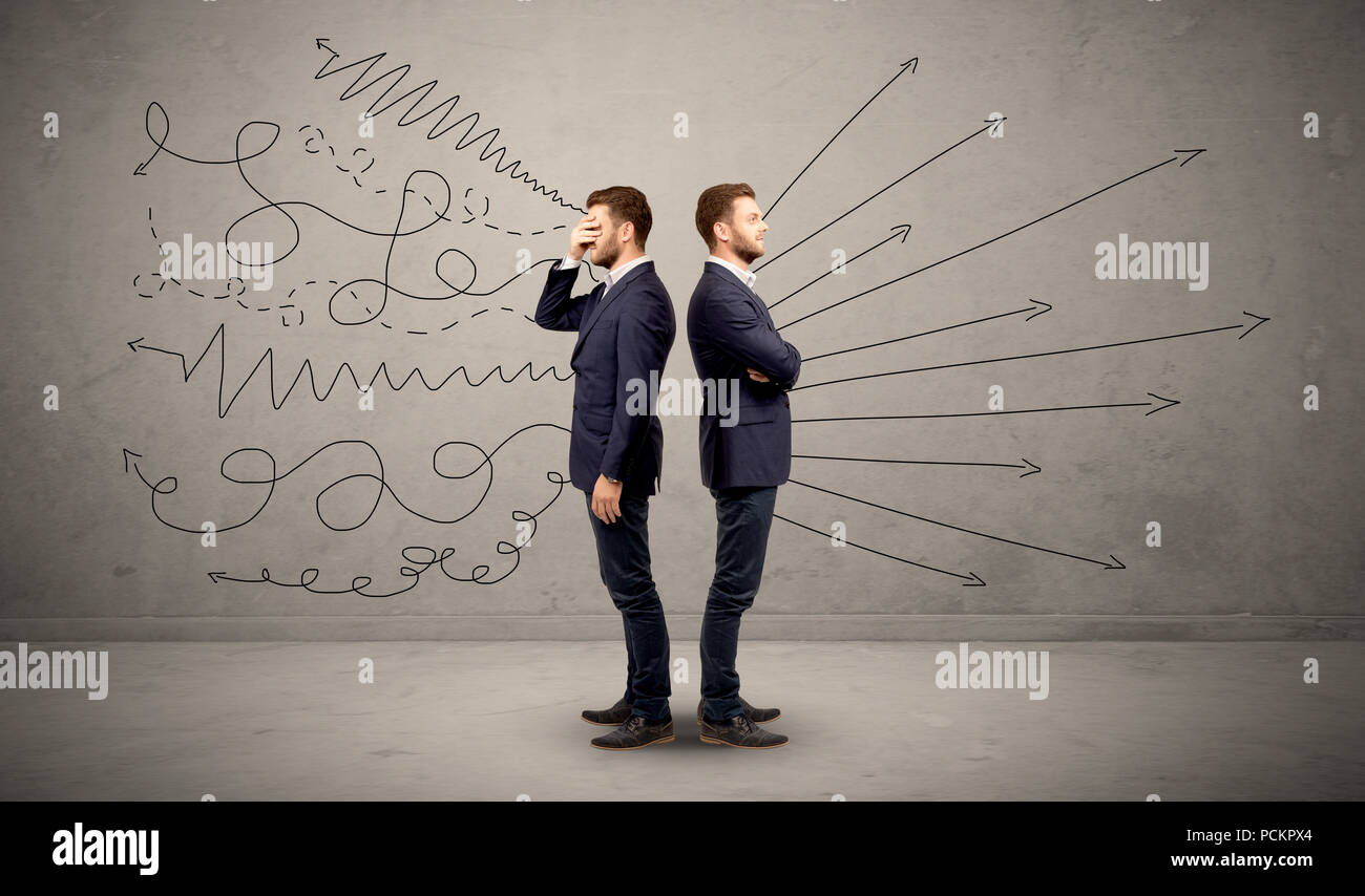 Young conflicted businessman choosing between two directions with