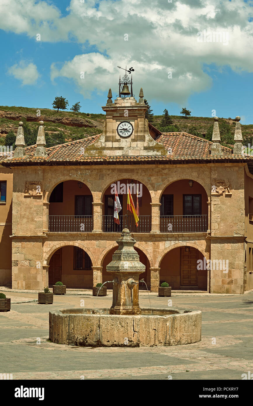 Fountain of the four pipes in the main square of the town of Ayllon with the city hall in the background, Segovia, Spain, Europe Stock Photo