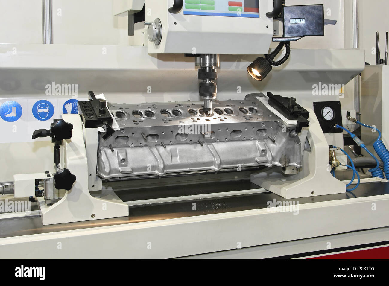 Machining engine head block at automated lathe Stock Photo Alamy