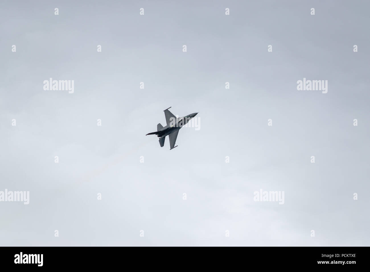 An F-16 performs a flypast at the 2018 Farnborough International Airshow Stock Photo