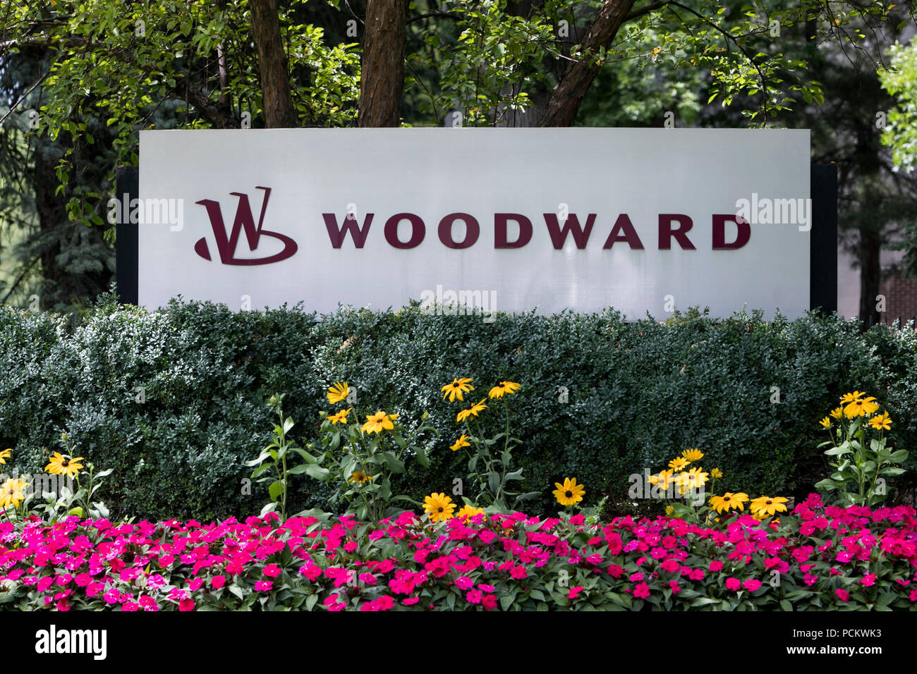 A logo sign outside of a facility occupied by Woodward, Inc., in Fort Collins, Colorado, on July