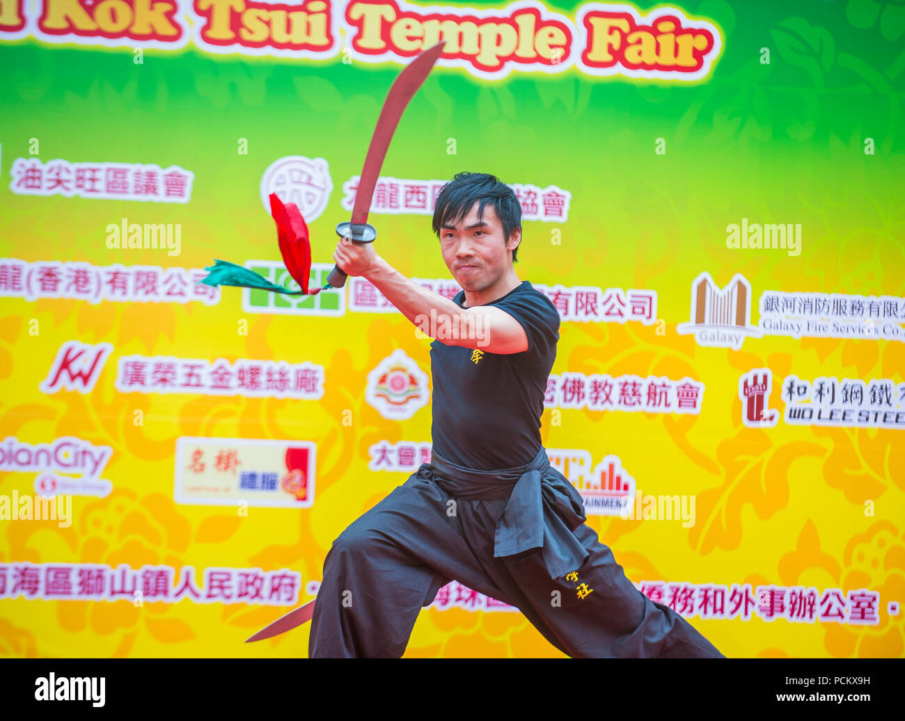 Martial arts demonstration during the 14th Tai Kok Tsui temple fair in Hong Kong Stock Photo