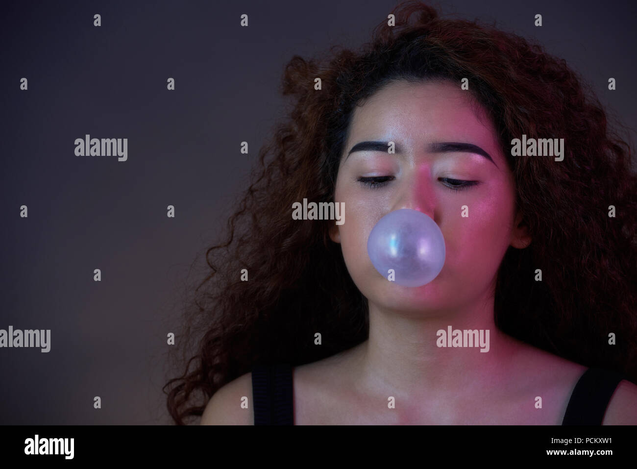 Teenager girl blow bubble gum ball close-up portrait Stock Photo