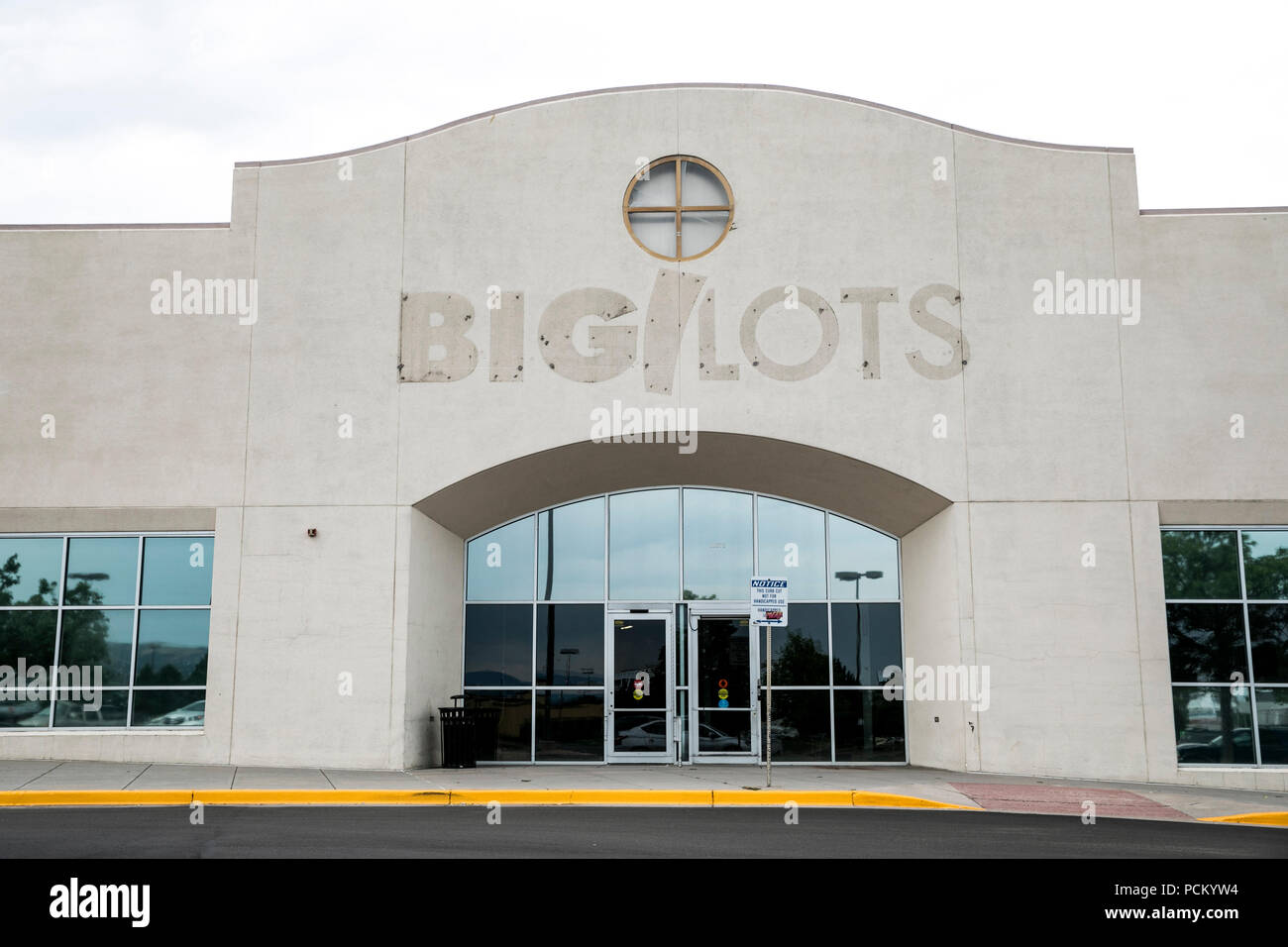 The faded outline of a logo sign outside of a closed Big Lots retail store location in Lakewood, Colorado, on July 22, 2018. Stock Photo