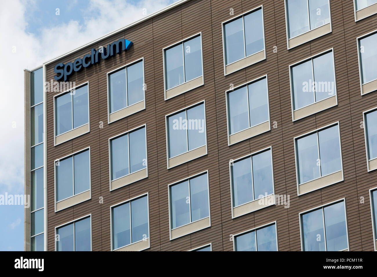 A logo sign outside of a facility occupied by cable television and internet provider Spectrum in Greenwood Village, Colorado, on July 22, 2018. Stock Photo