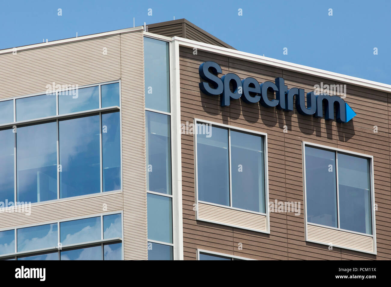 A logo sign outside of a facility occupied by cable television and internet provider Spectrum in Greenwood Village, Colorado, on July 22, 2018. Stock Photo