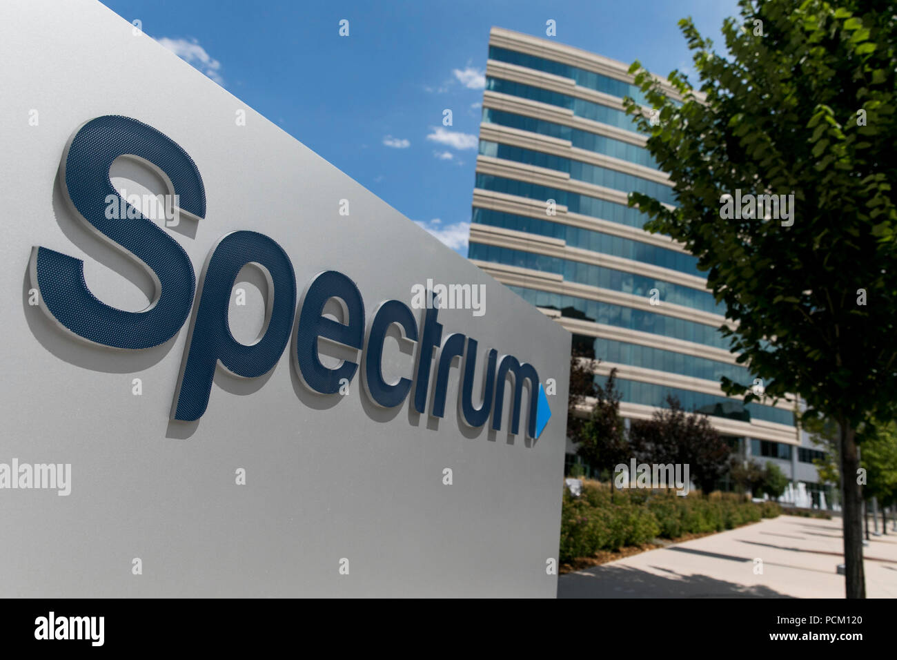 A logo sign outside of a facility occupied by cable television and internet provider Spectrum in Greenwood Village, Colorado, on July 22, 2018. Stock Photo