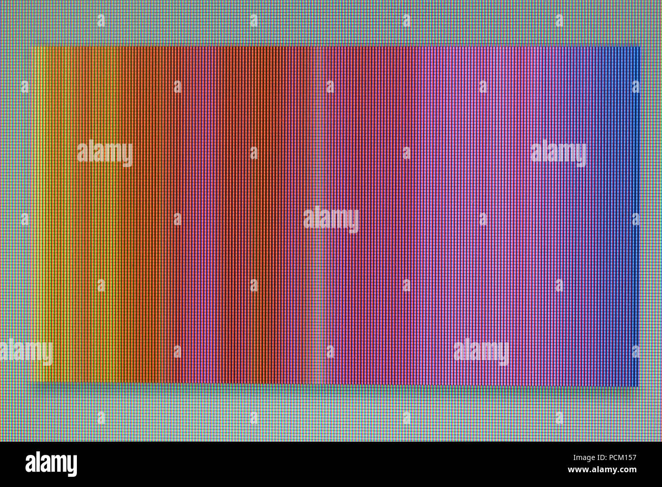 A macro photo of a chaotic colored striped noise on the monitor screen. A well-seen pixel structure Stock Photo