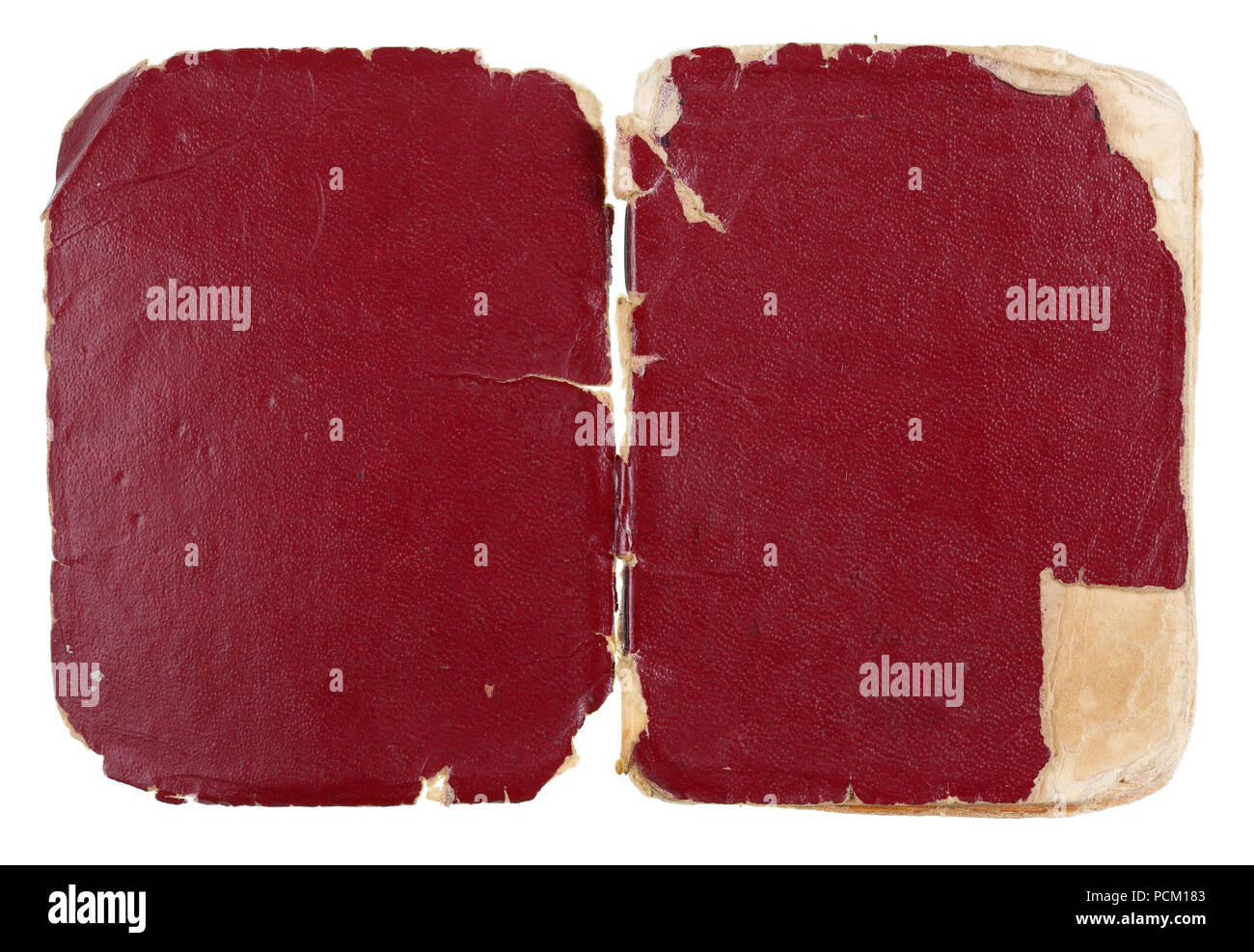 Opened  red cover of the old aged used  dirty  book. Isolated on white studio macro shot Stock Photo