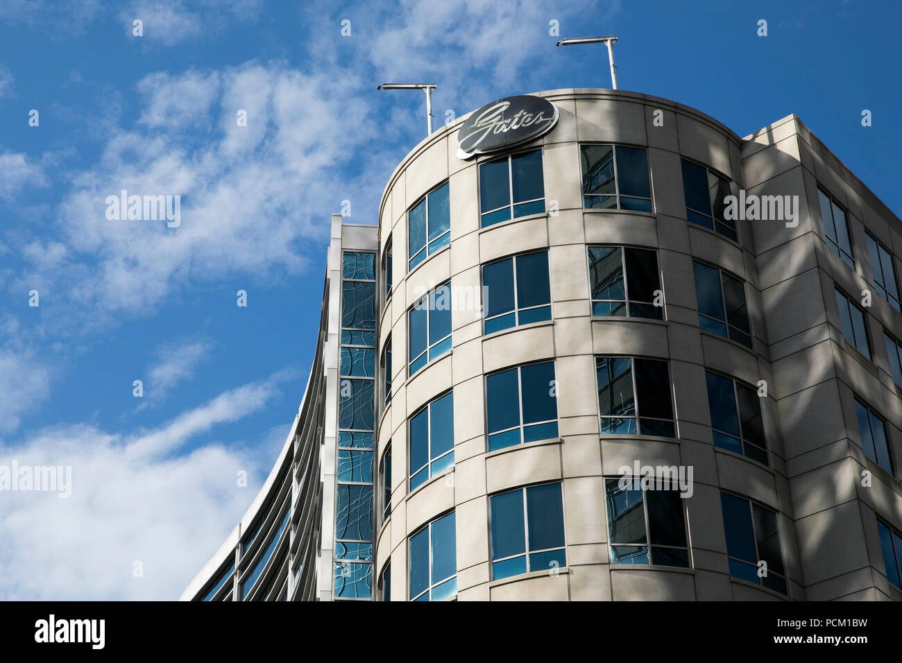 A logo sign outside of the headquarters of the Gates Corporation in