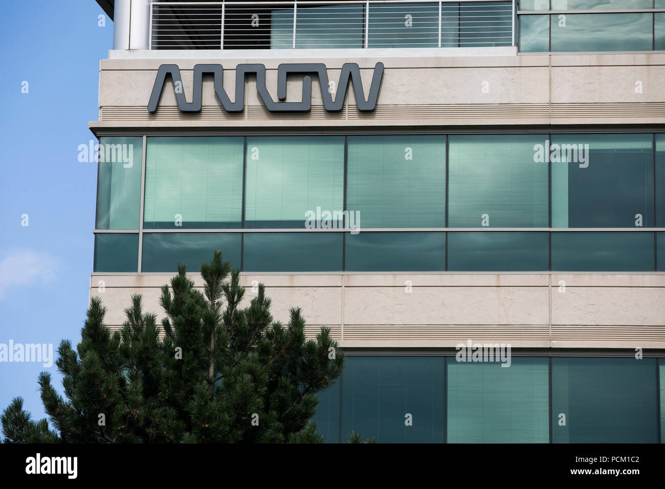 A logo sign outside of the headquarters of Arrow Electronics in