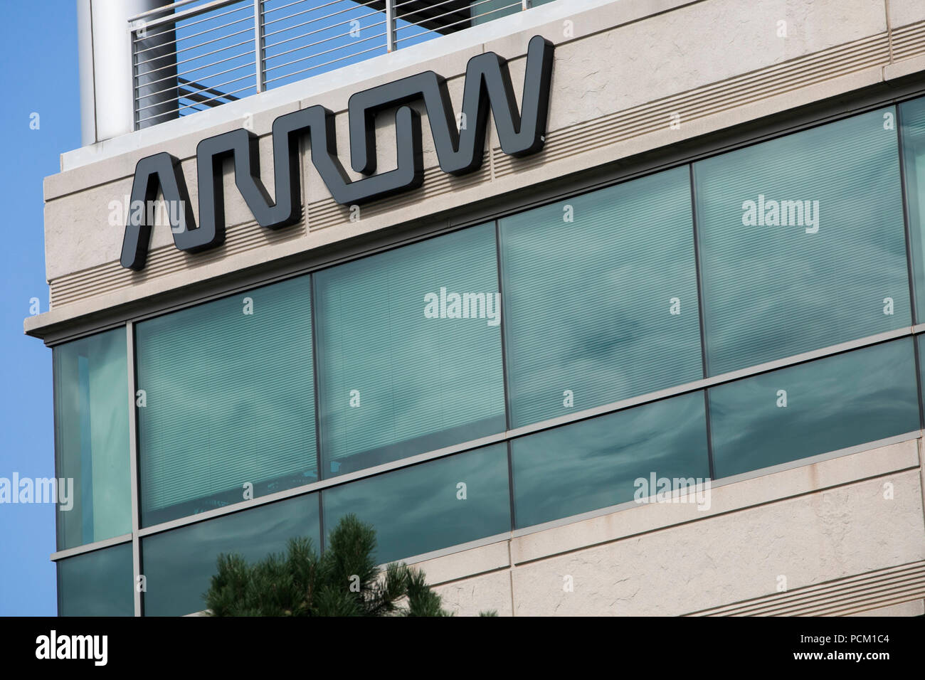 A logo sign outside of the headquarters of Arrow Electronics in