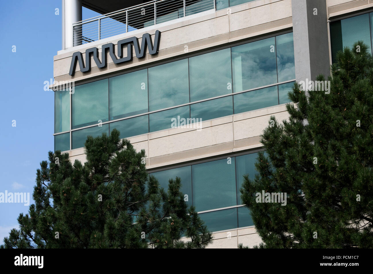 A logo sign outside of the headquarters of Arrow Electronics in
