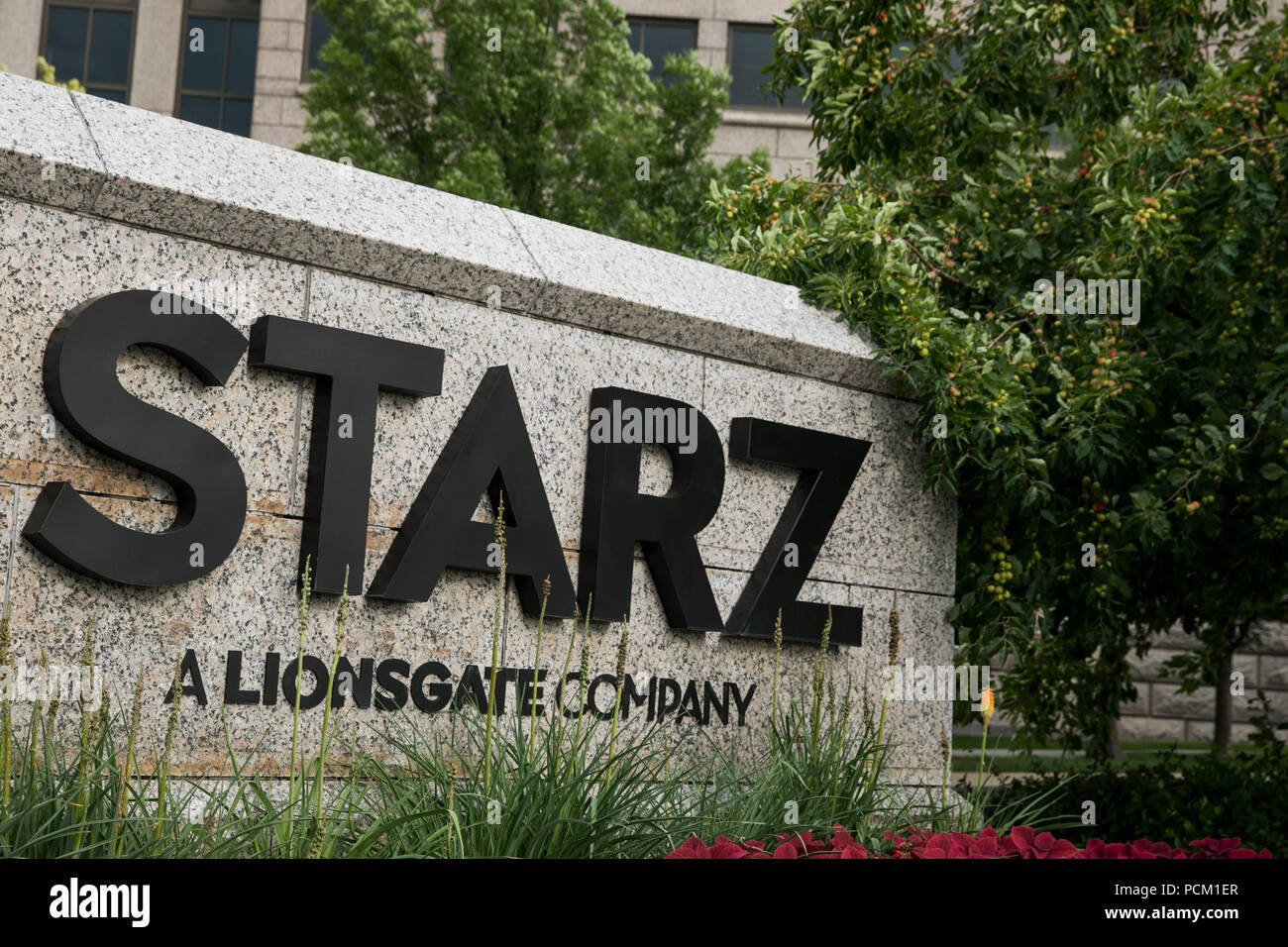 A logo sign outside of the headquarters of cable television network Starz in Englewood, Colorado, on July 22, 2018. Stock Photo
