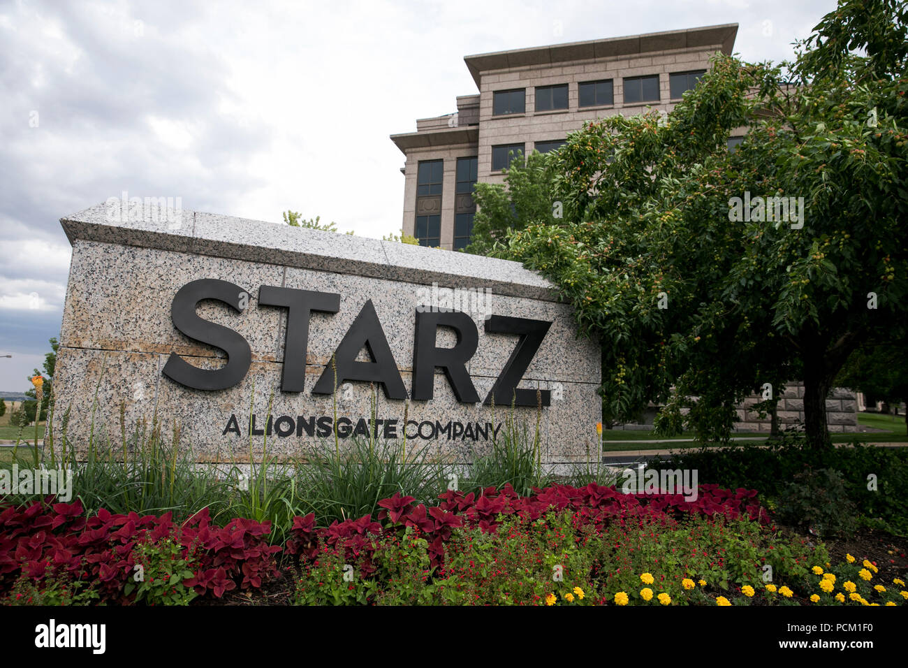 A logo sign outside of the headquarters of cable television network Starz in Englewood, Colorado, on July 22, 2018. Stock Photo