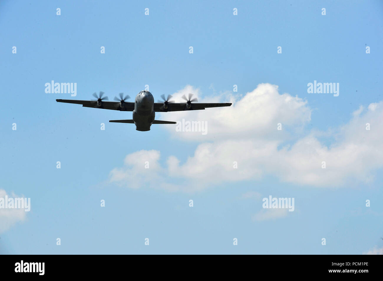 A U.S. Air Force C-130J Super Hercules assigned to the 86th Airlift Wing flies over Powidz Air Base, Poland, July 31, 2018, during a training exercise. U.S. Airmen and Soldiers arrived in Poland to conduct tactical airlift training and with the Polish armed forces. (U.S. Air Force photo by Senior Airman Joshua Magbanua) Stock Photo