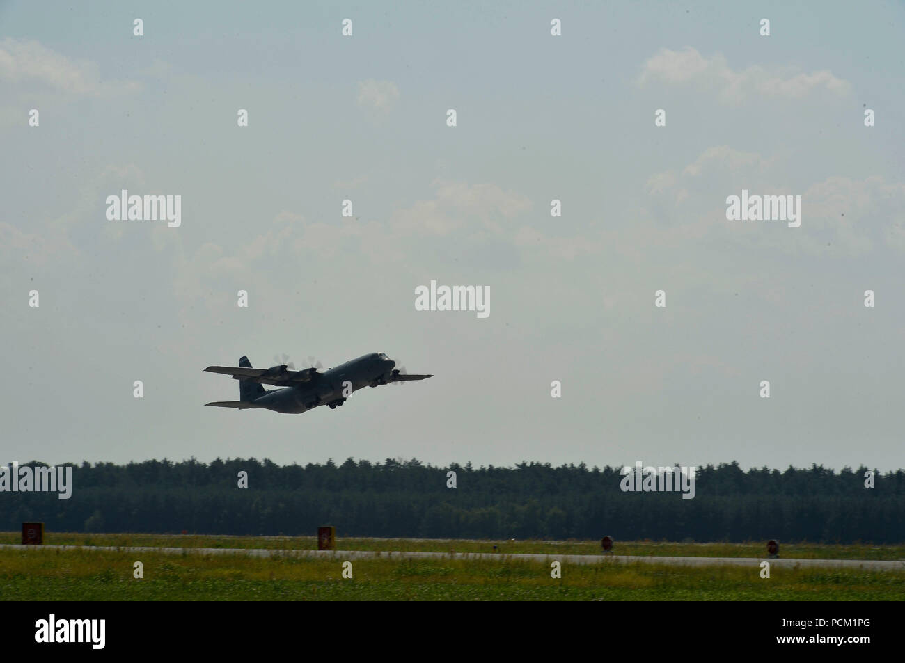 A U.S. Air Force C-130J Super Hercules assigned to the 86th Airlift Wing takes off from Powidz Air Base, Poland, July 31, 2018. Approximately 100 Airmen and three aircraft arrived in Poland to conduct bilateral training exercises with the Polish Air Force. (U.S. Air Force photo by Senior Airman Joshua Magbanua) Stock Photo