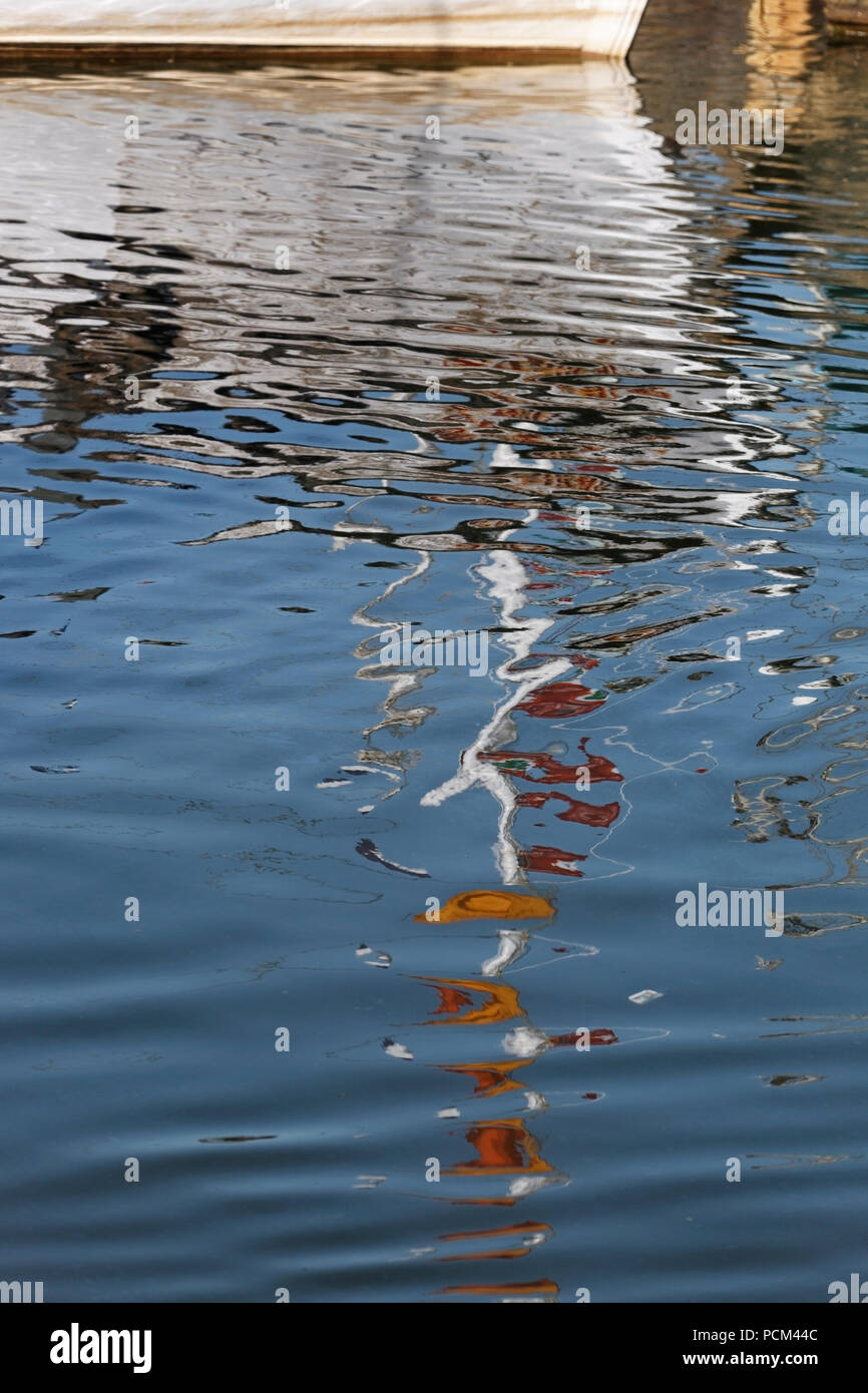Abstract reflection of boats in water Stock Photo - Alamy