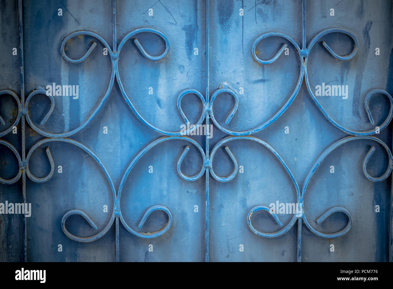 Old wrought iron bars on the gate with grunge and rusty steel