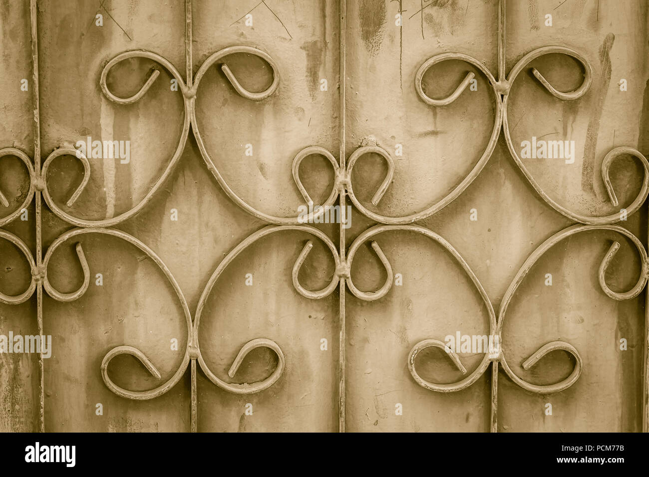Old wrought iron bars on the gate with grunge and rusty steel