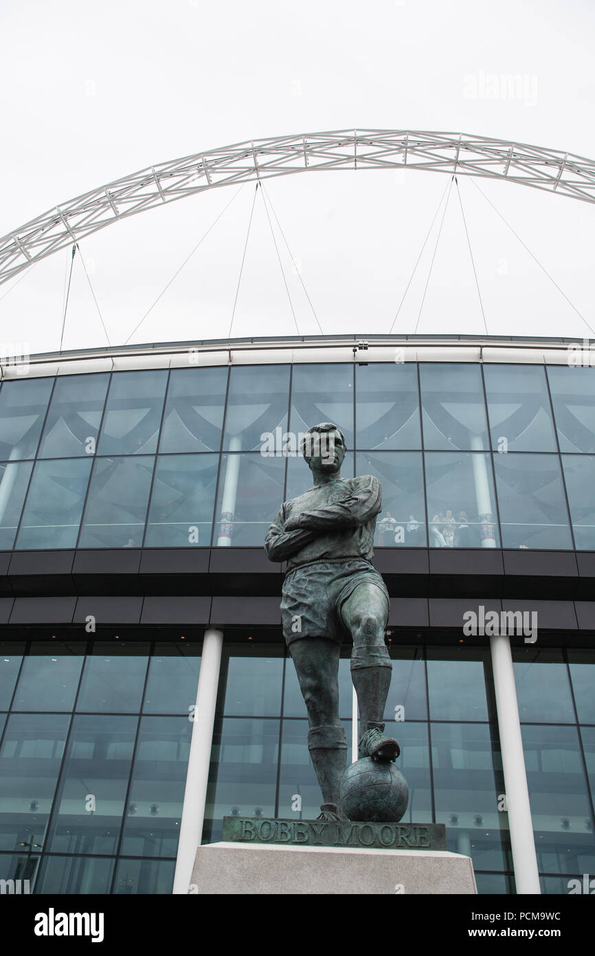 Bobby Moore,famous,West Ham United,defender,in,football,kit,ball,footballer,statue,at,Wembley,Way,Wembley Way,stadium,London,England,UK,U.K.,Europe, Stock Photo